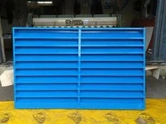 A blue metal grate with numerous perforations, allowing for efficient airflow and drainage.